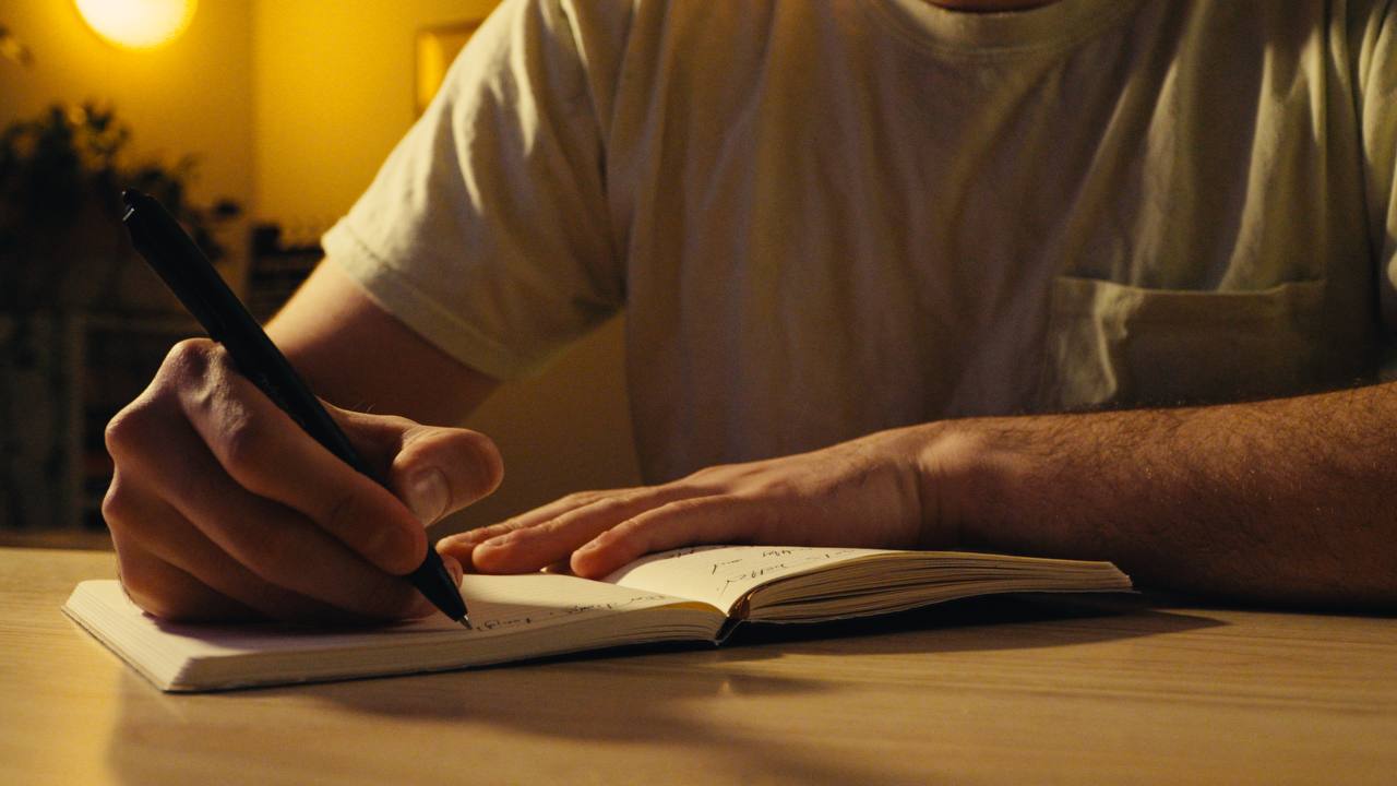 Close hands, writing